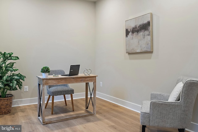 office space featuring wood finished floors and baseboards