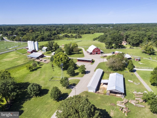 bird's eye view featuring a forest view and a rural view