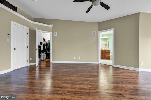 unfurnished living room featuring visible vents, baseboards, and wood finished floors