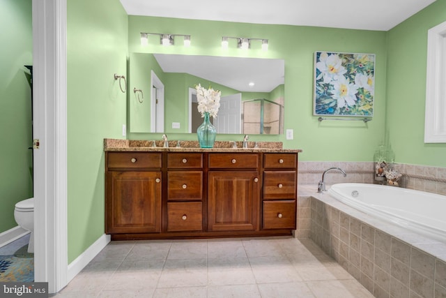 bathroom featuring double vanity, toilet, a shower stall, tile patterned flooring, and a bath