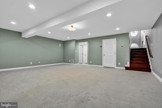 interior space featuring visible vents, baseboards, light colored carpet, stairs, and recessed lighting