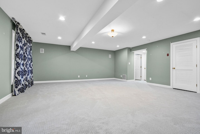 below grade area with baseboards, visible vents, and recessed lighting