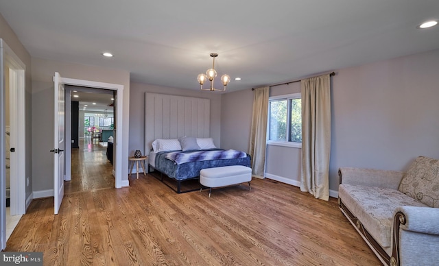 bedroom with light wood-style floors, recessed lighting, and baseboards