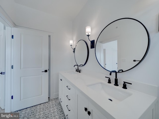 full bathroom featuring a sink and double vanity