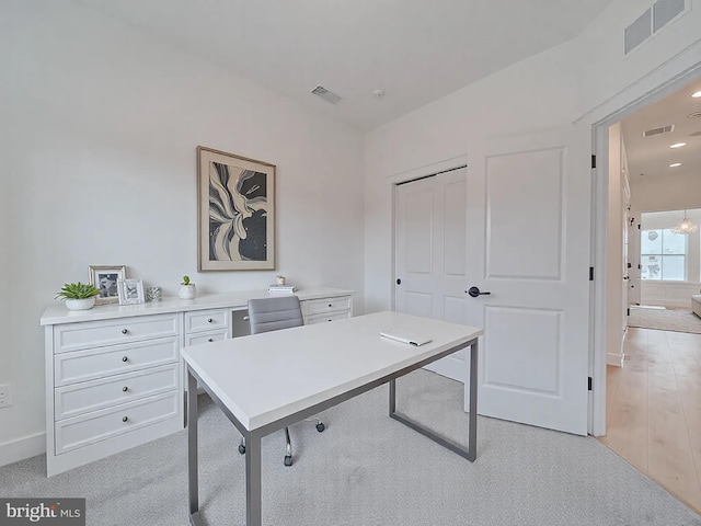 office space with recessed lighting, visible vents, and baseboards