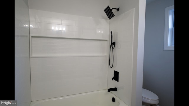 bathroom featuring toilet and bathtub / shower combination