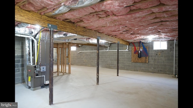 below grade area featuring heating unit