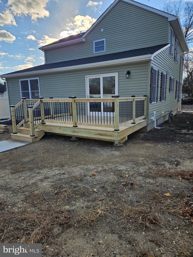 rear view of property with a deck