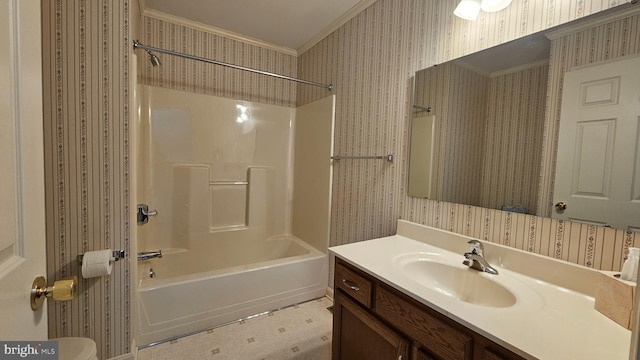 bathroom with ornamental molding, tub / shower combination, vanity, and wallpapered walls