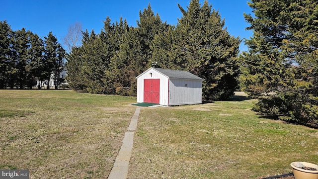 view of yard featuring an outbuilding and a shed