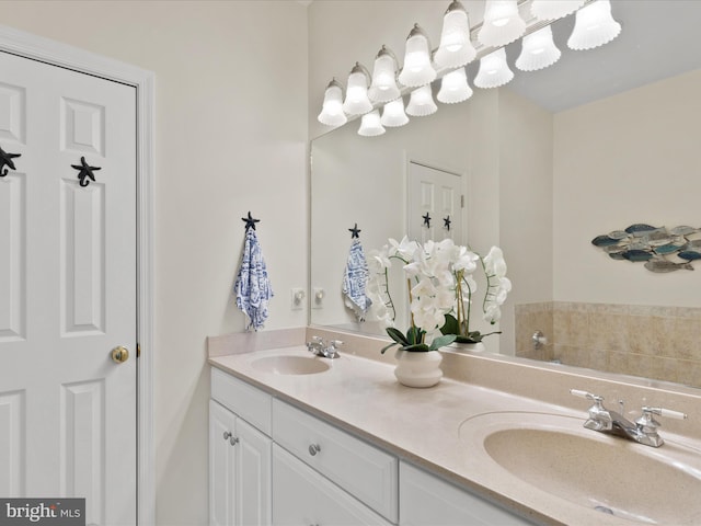 bathroom with double vanity and a sink