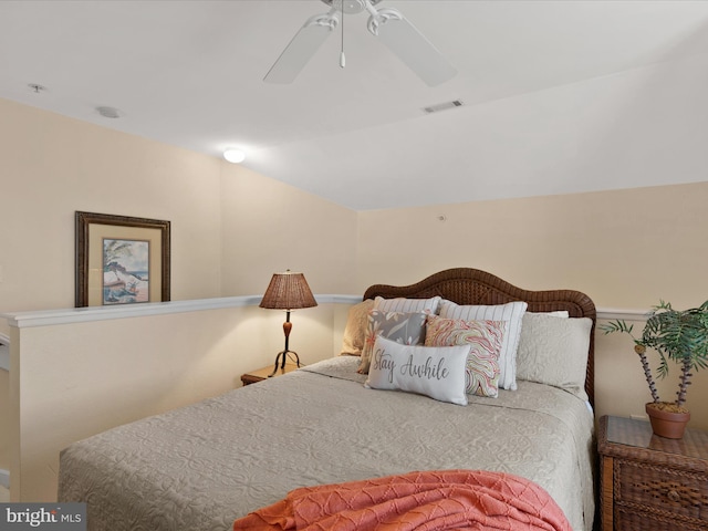 bedroom with visible vents, a ceiling fan, and vaulted ceiling