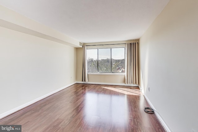 3101 New Mexico Ave NW Unit 847, Washington, DC 20016 - spare room with wood finished floors and baseboards