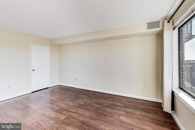 3101 New Mexico Ave NW Unit 847, Washington, DC 20016 - spare room with wood finished floors, visible vents, and baseboards