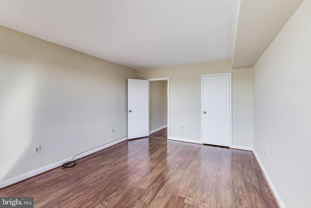 3101 New Mexico Ave NW Unit 847, Washington, DC 20016 - unfurnished bedroom featuring wood finished floors and baseboards