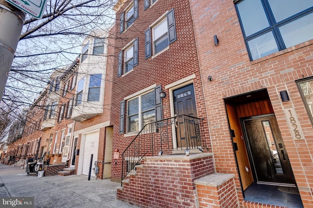 entrance to property with brick siding