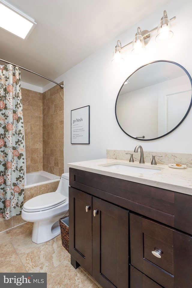 full bathroom with shower / tub combo, vanity, and toilet