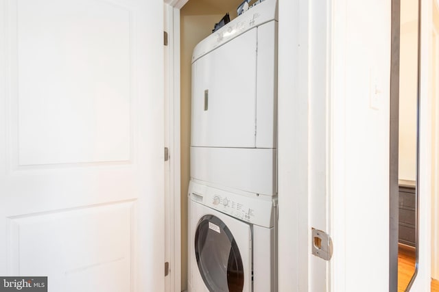 laundry room featuring laundry area and stacked washer and clothes dryer