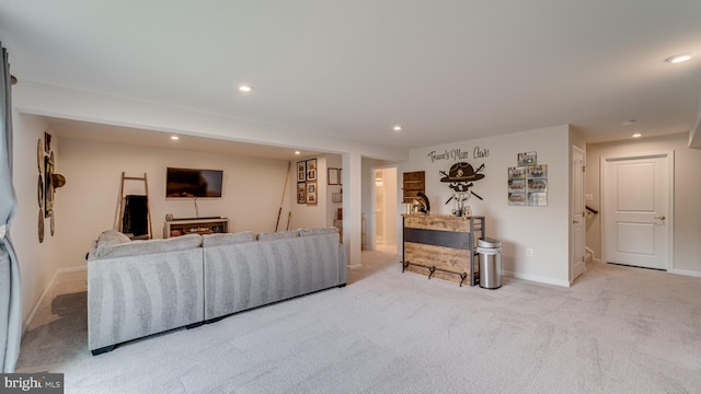 living area with recessed lighting, carpet, and baseboards