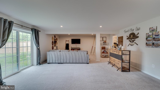 carpeted living room with baseboards and recessed lighting