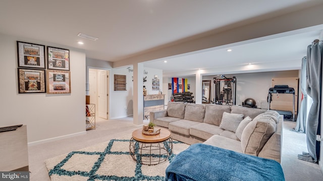 living room with recessed lighting, baseboards, visible vents, and light colored carpet