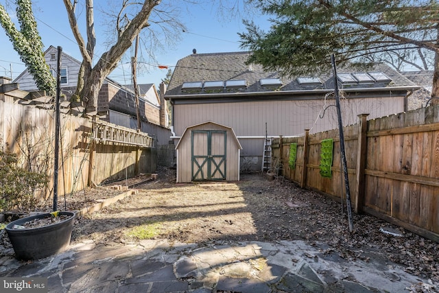 23 Swan St, Lambertville, NJ 08530 - view of yard with an outbuilding, a fenced backyard, and a storage shed