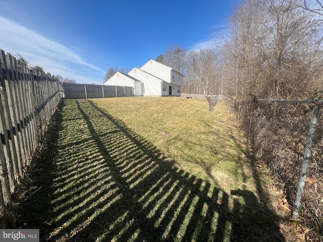 view of yard with a fenced backyard