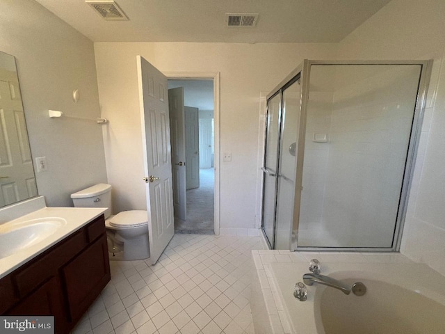 bathroom with a garden tub, a stall shower, vanity, and visible vents