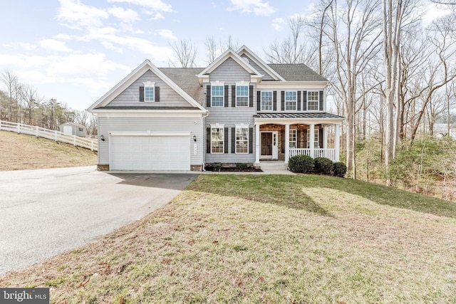 view of front of home featuring covered porch, fence, driveway, roof with shingles, and a front yard