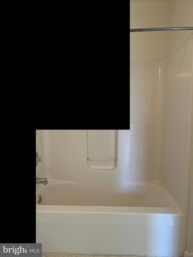 bathroom with tub / shower combination