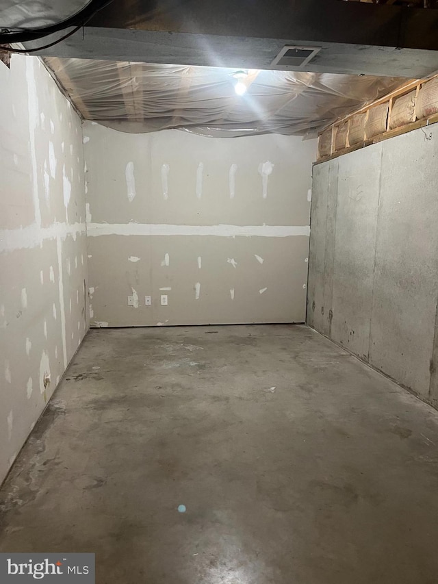 unfinished basement featuring visible vents