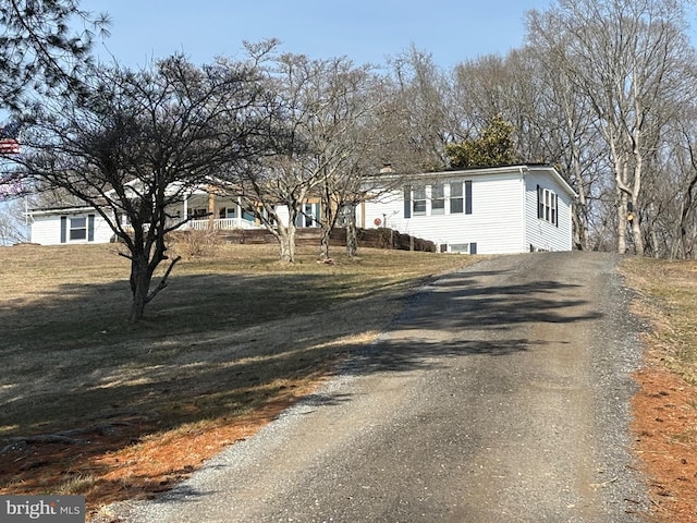 view of front of property with driveway and a front yard