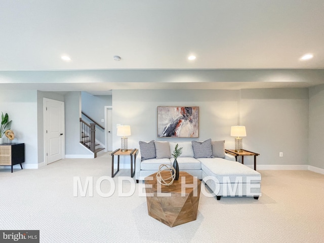 carpeted living room with stairs, baseboards, and recessed lighting