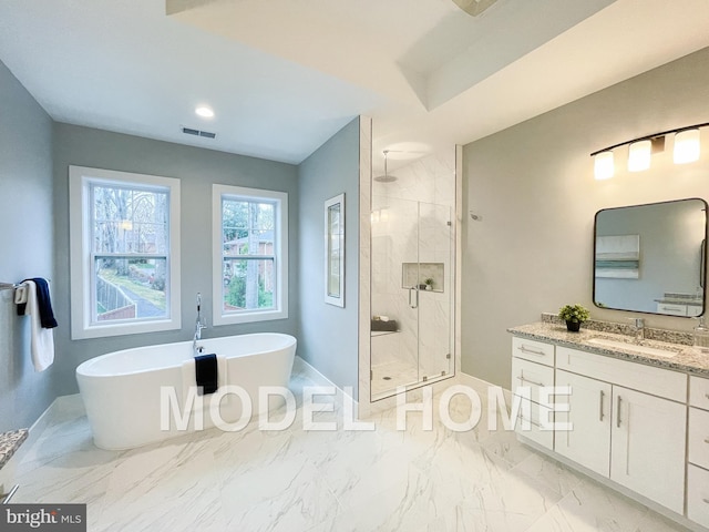 bathroom featuring vanity, visible vents, a freestanding bath, marble finish floor, and a shower stall