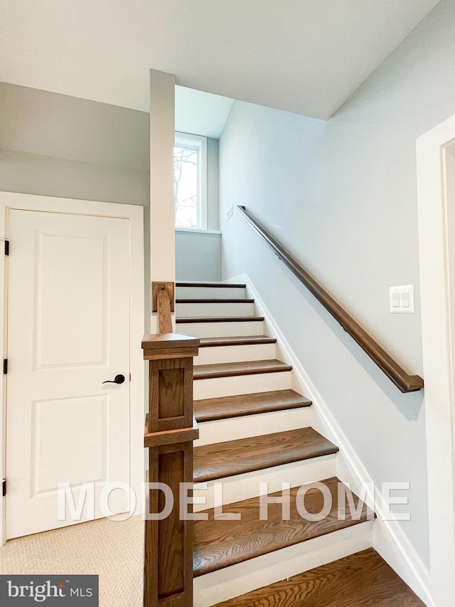 stairs featuring baseboards