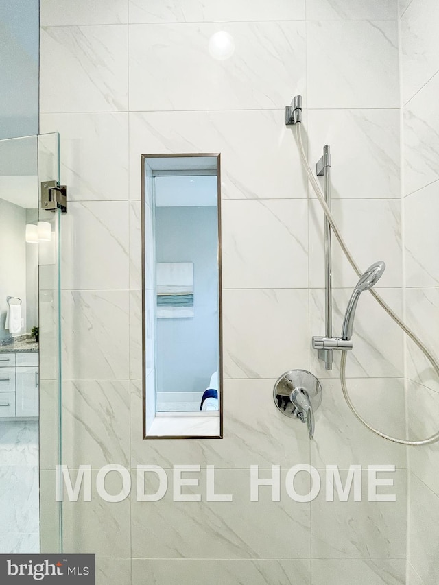 full bath featuring a tile shower