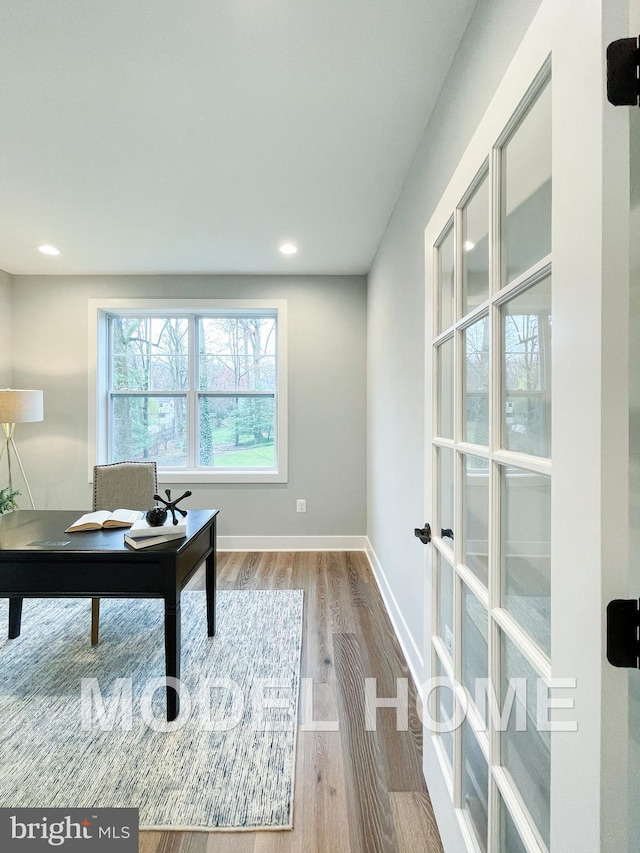 home office with baseboards, wood finished floors, and recessed lighting