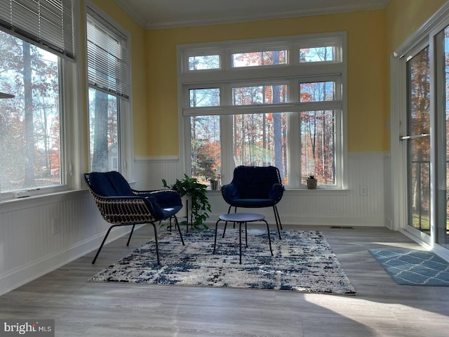 sunroom with a healthy amount of sunlight and visible vents