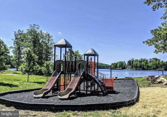 community play area featuring a water view and a yard