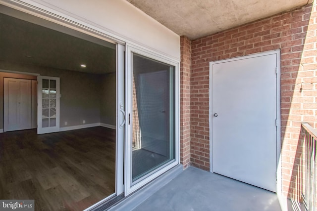 property entrance with brick siding