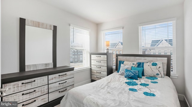 bedroom featuring baseboards