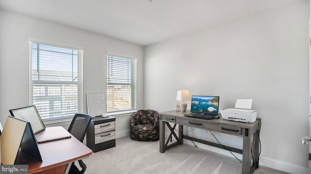 home office with baseboards and carpet flooring