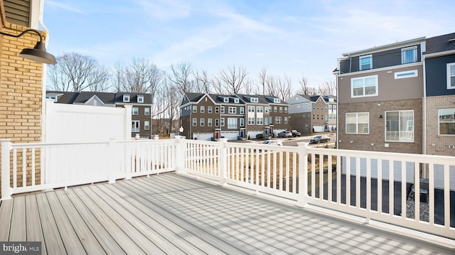 wooden terrace featuring a residential view