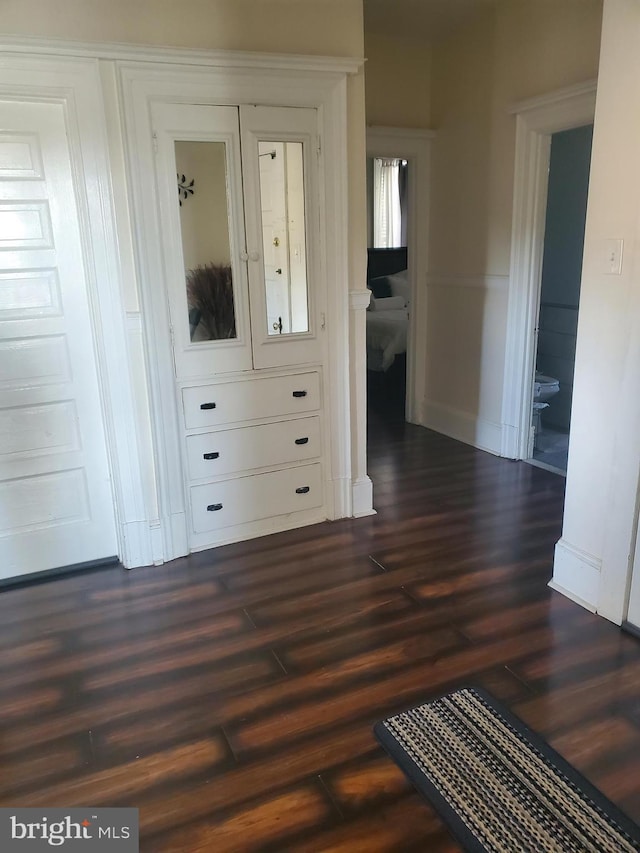 hallway featuring dark wood-style floors