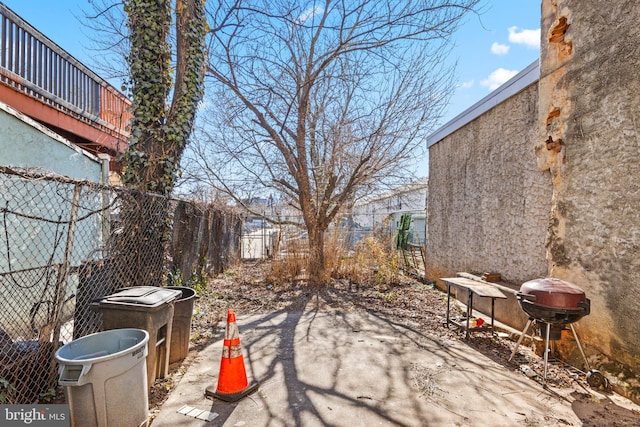 exterior space with fence and area for grilling