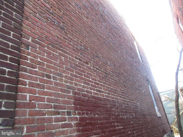 view of home's exterior with brick siding