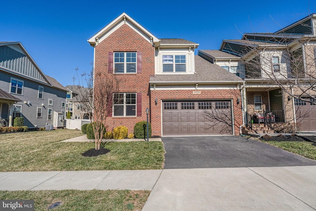 view of front of property with aphalt driveway, an attached garage, brick siding, a shingled roof, and a front lawn