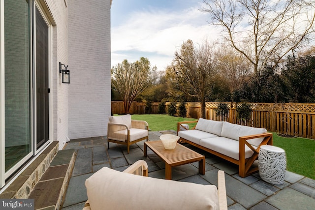 view of patio with an outdoor hangout area and a fenced backyard