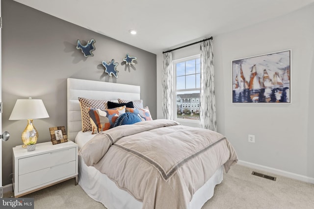 bedroom featuring light carpet, recessed lighting, visible vents, and baseboards