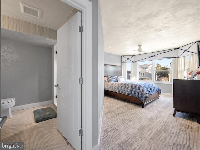 bedroom with carpet, visible vents, and baseboards